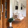 double hanging chair on porch
