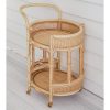 natural rattan bar cart against white wall