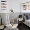 white hanging chair in kids room