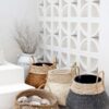 black white and brown pot sitting against white wall