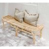 rattan bench seat with grey cushions on top