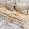 rattan bench seat with grey cushions on top