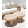 raw round coffee table with white lounge setting
